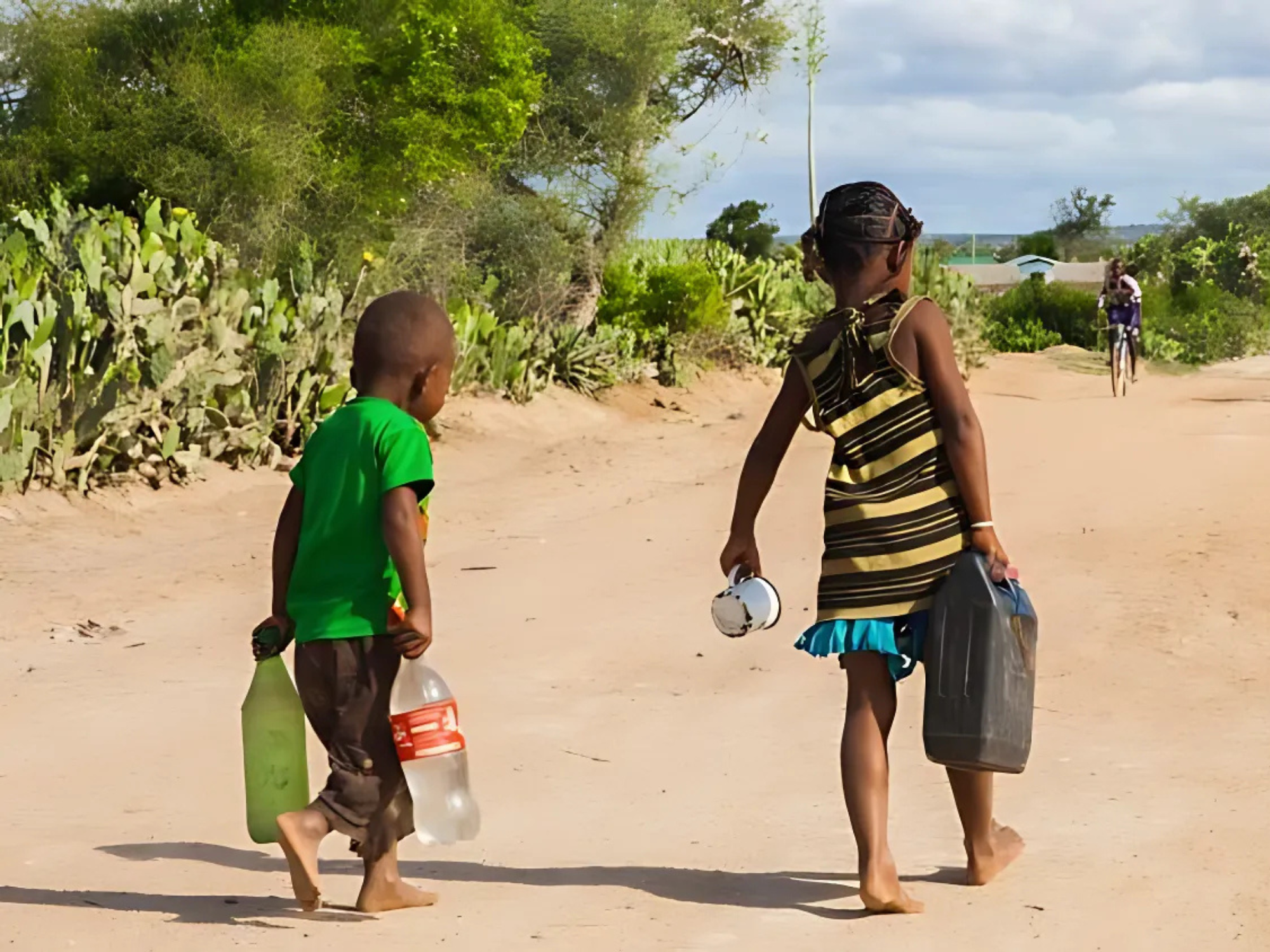 Two children in Sub-Saharan Africa carry basic utilities.
Image Source: Vatican News