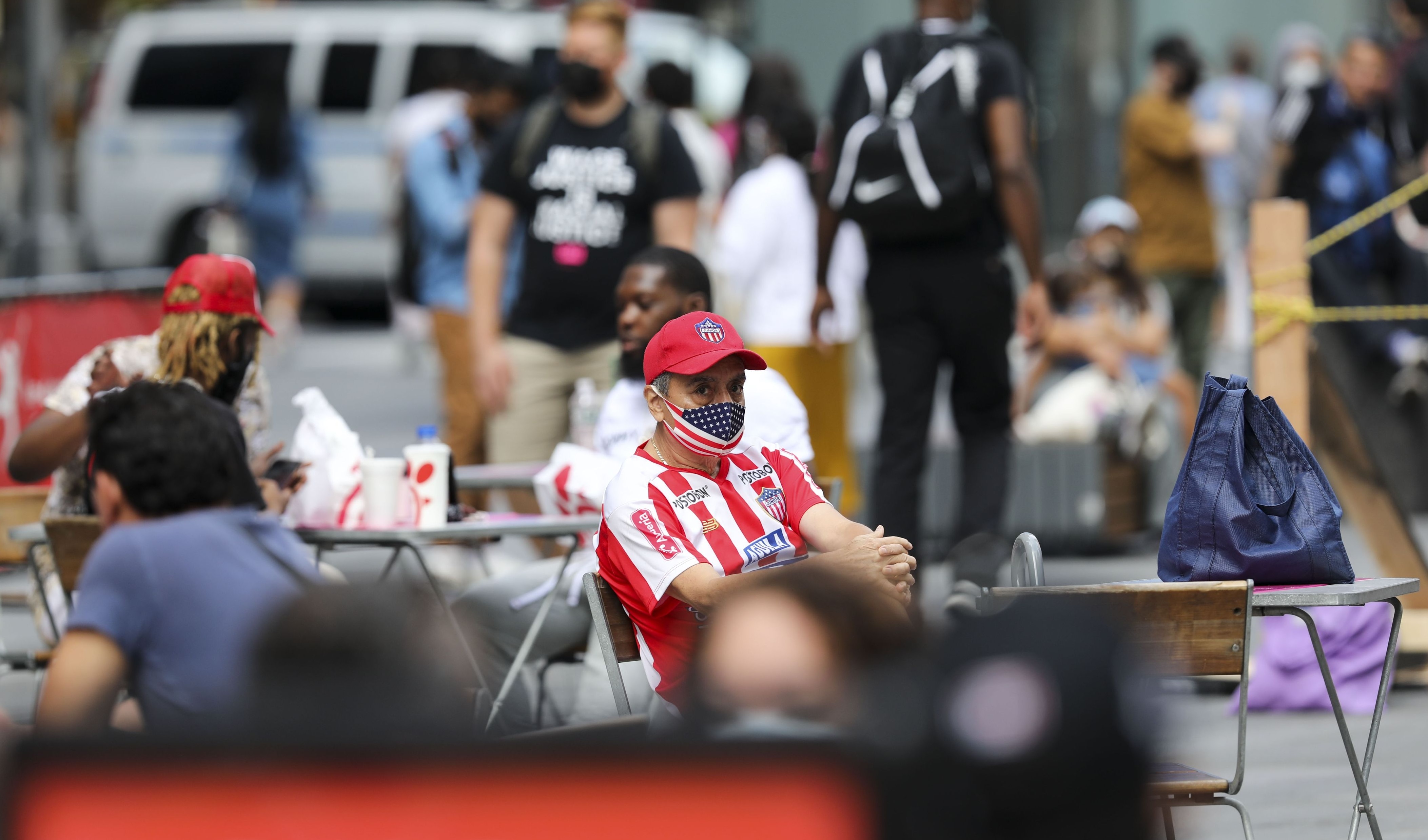 a labor is sitting on a chair and seems not willing to work, this increases production cost and cause a high inflation
